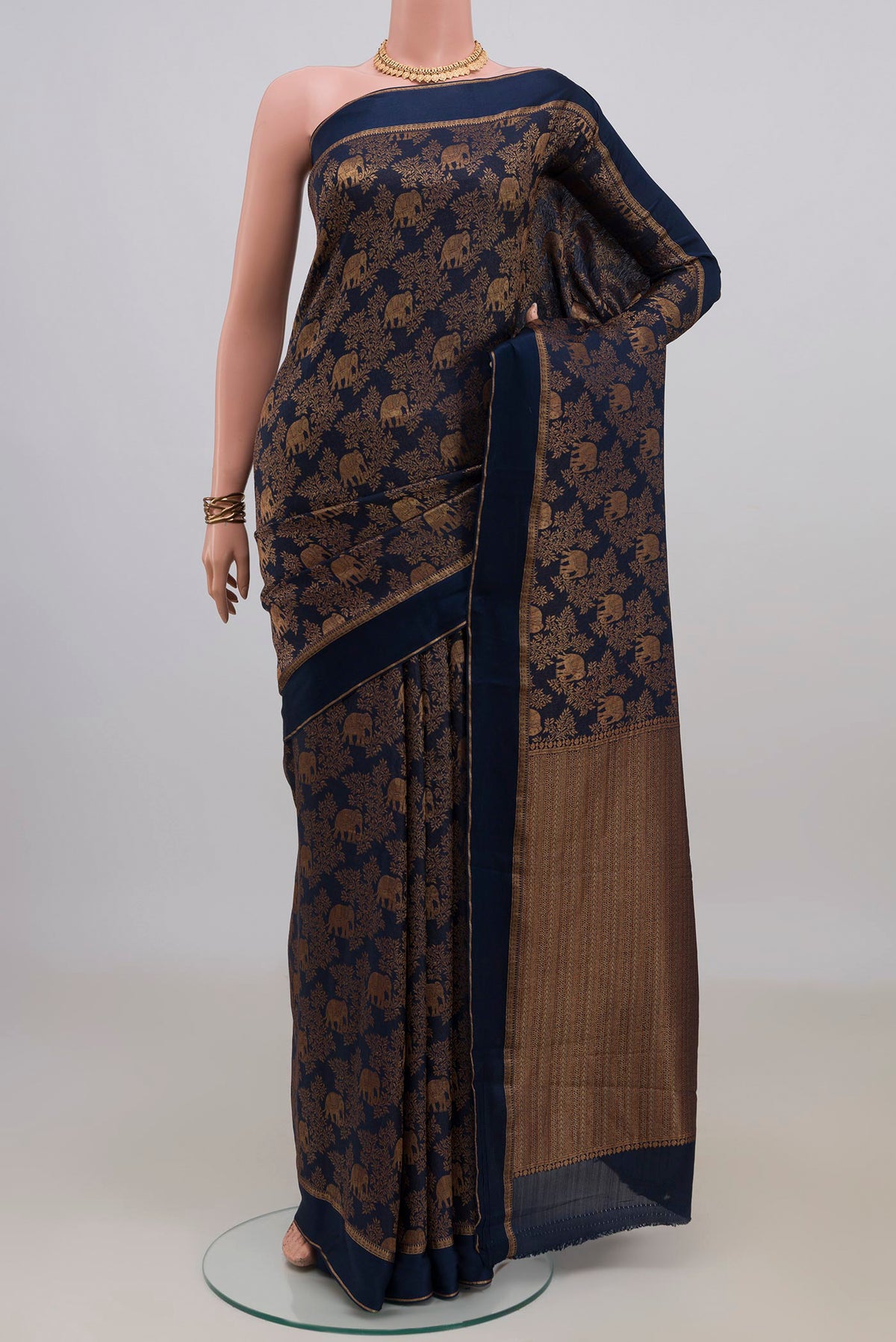 Navy Blue Mysore Crepe Saree with Zari Brocade on the body and Zari Border.  displayed on a mannequin