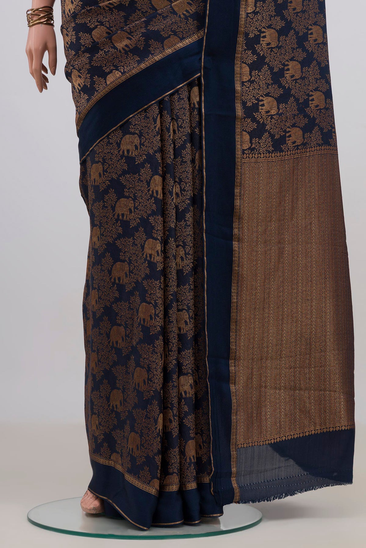 Pleats and pallu of Navy Blue Mysore Crepe Saree with Zari Brocade on the body and Zari Border. 