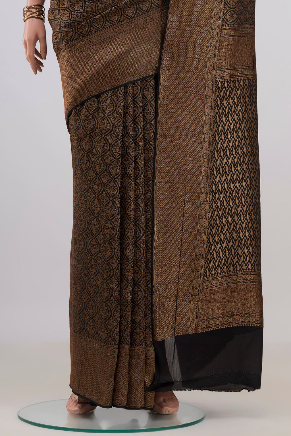 Pleats and pallu of Black Mysore Crepe Saree with Zari Brocade on the body and Zari Border. 