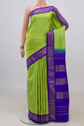 Pure Silk Parrot Green Kanchipuram Nine Yards Saree with Plain Body and Zari Border.  displayed on a mannequin