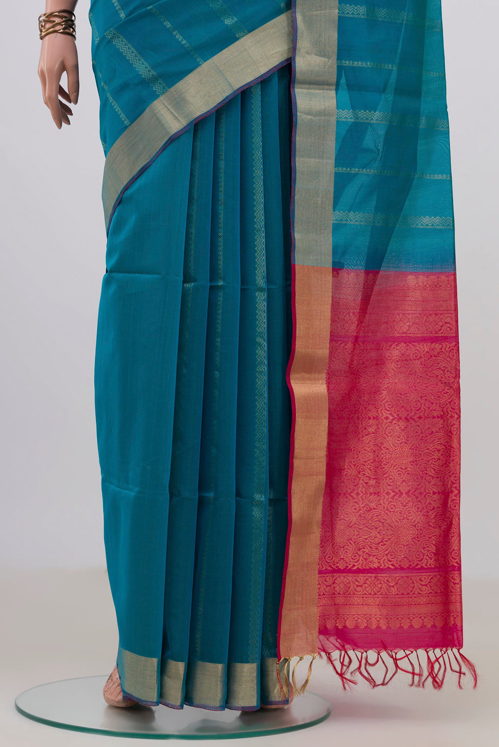 Pleats and pallu of Blue Silk Cotton Saree with Stripes on the body and Zari Border. 