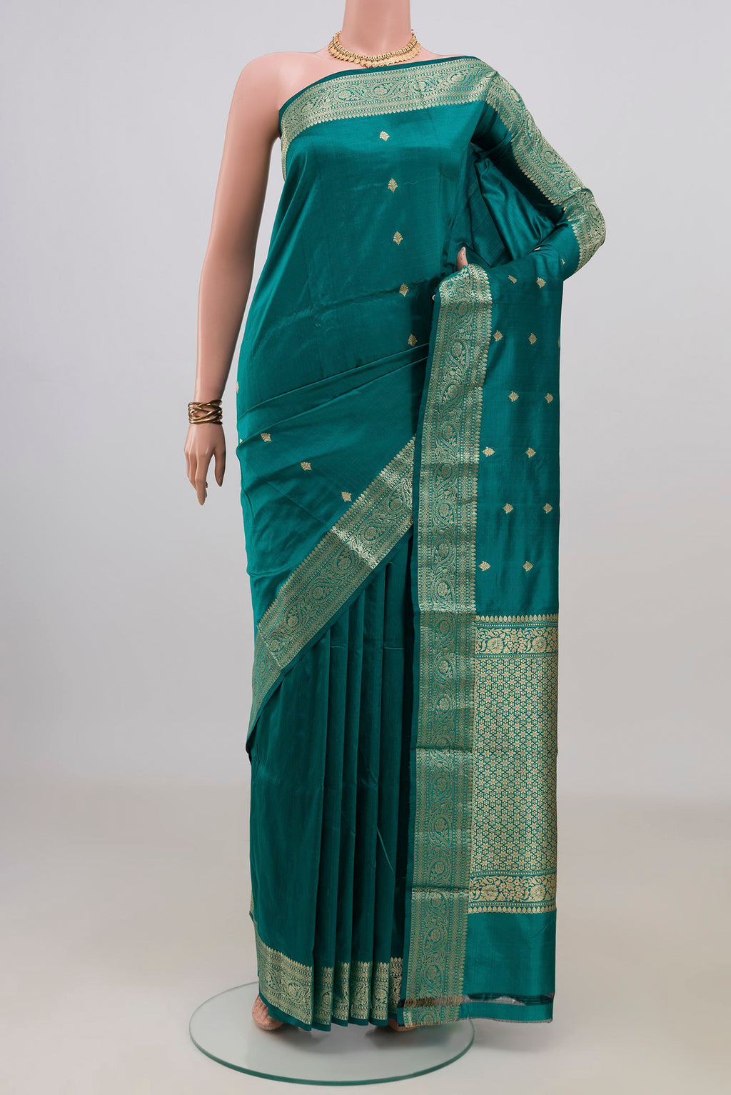 Pure Silk Green Banarasi Katan Saree with Zari Butta on the body and Zari Border.  displayed on a mannequin