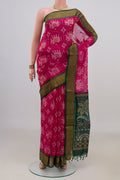 Pink Silk Cotton Saree with Ikat Print on the body and Zari Border.  displayed on a mannequin