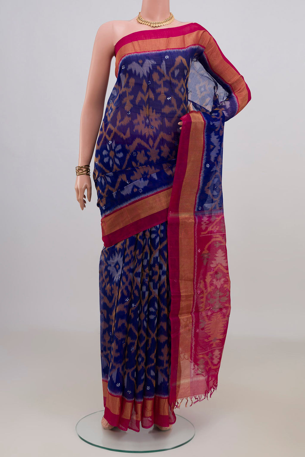 Blue Silk Cotton Saree with Ikat Print on the body and Zari Border.  displayed on a mannequin