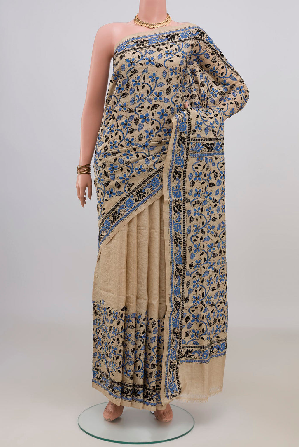 Beige Tussar Saree with Kantha Work on the body and Thread Border.  displayed on a mannequin