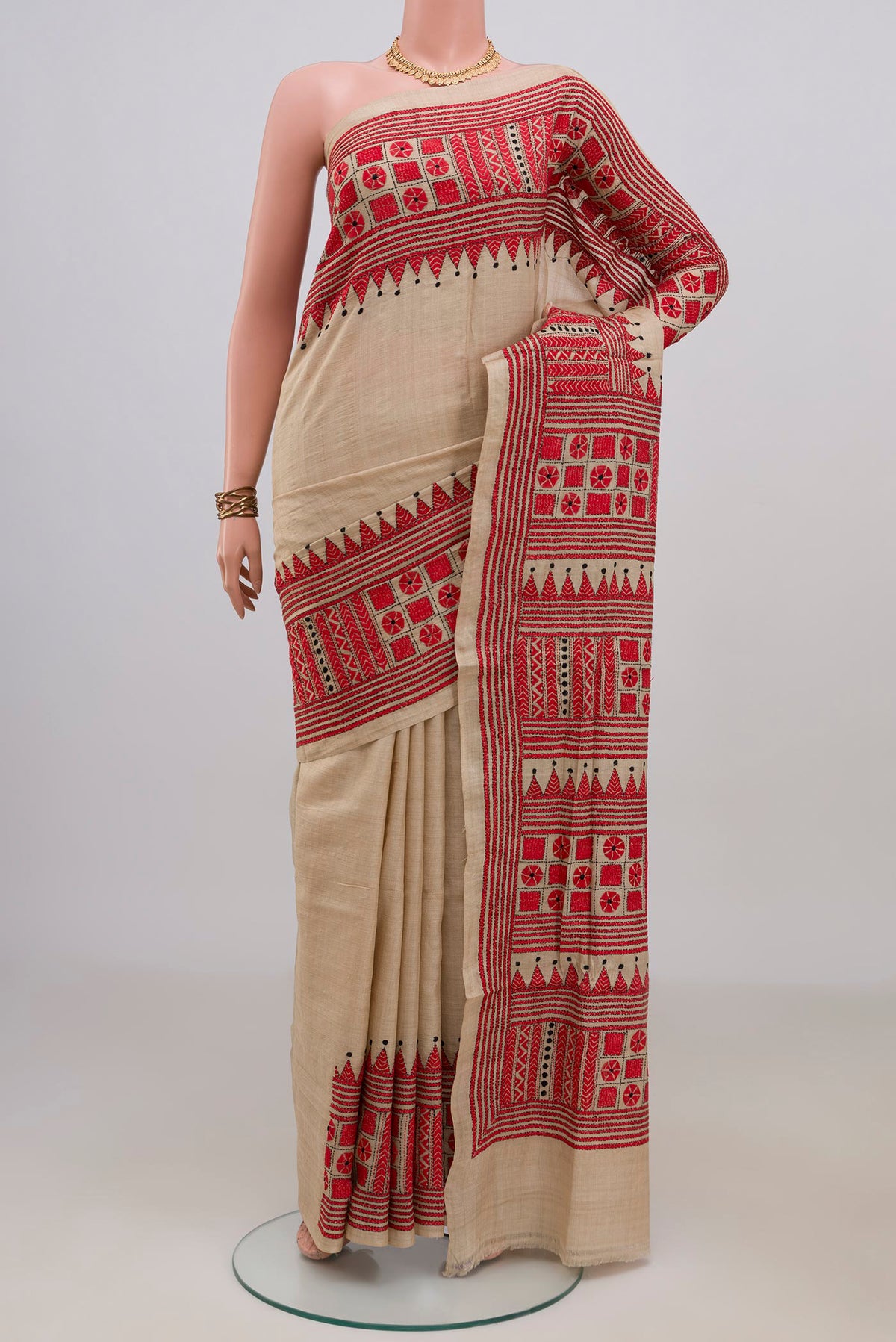 Beige Tussar Saree with Kantha Work on the body and Embroidery Border.  displayed on a mannequin