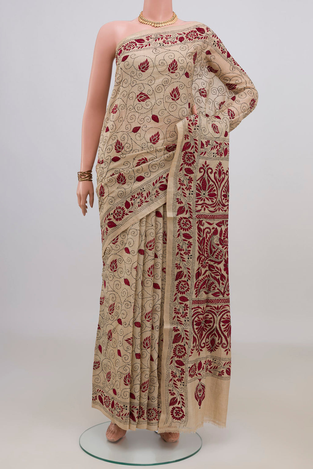 Beige Tussar Saree with Kantha Work on the body and Embroidery Border.  displayed on a mannequin