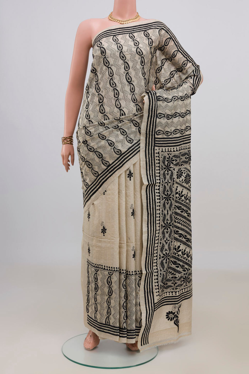 Cream Tussar Saree with Kantha Work on the body and Thread Border.  displayed on a mannequin