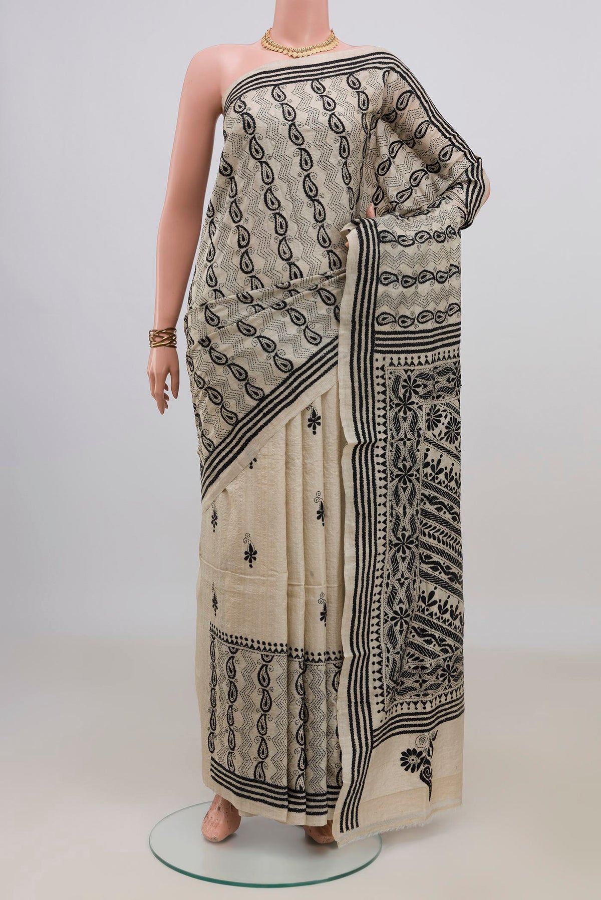 Cream Tussar Saree with Kantha Work on the body and Thread Border.  displayed on a mannequin