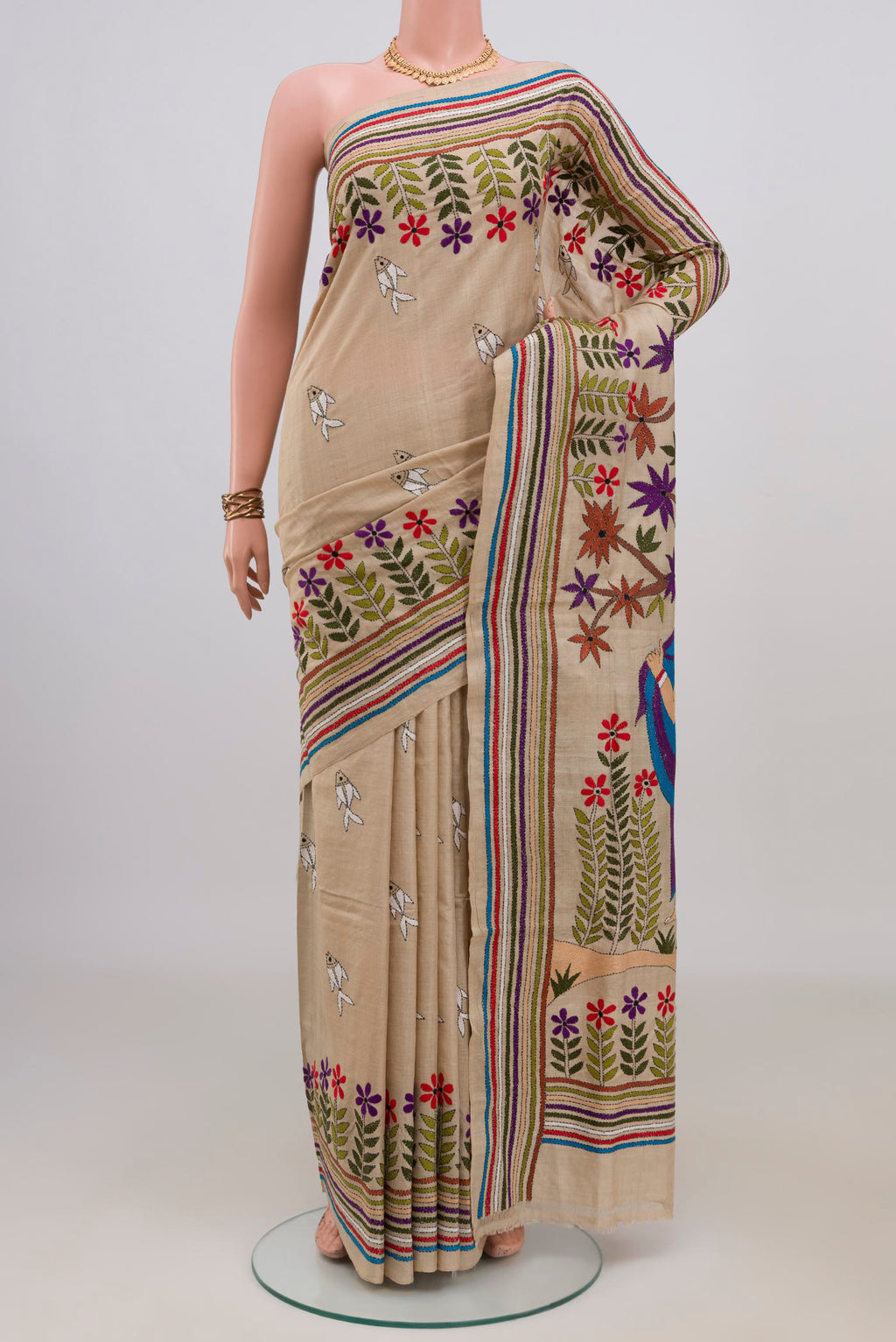Beige Tussar Saree with Kantha Work on the body and Embroidery Border.  displayed on a mannequin