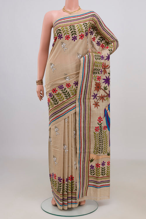 Beige Tussar Saree with Kantha Work on the body and Embroidery Border.  displayed on a mannequin