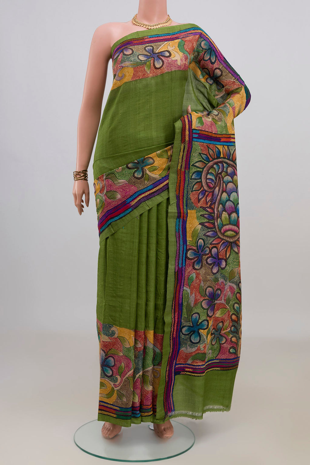 Green Tussar Saree with Plain Body and Thread Border.  displayed on a mannequin