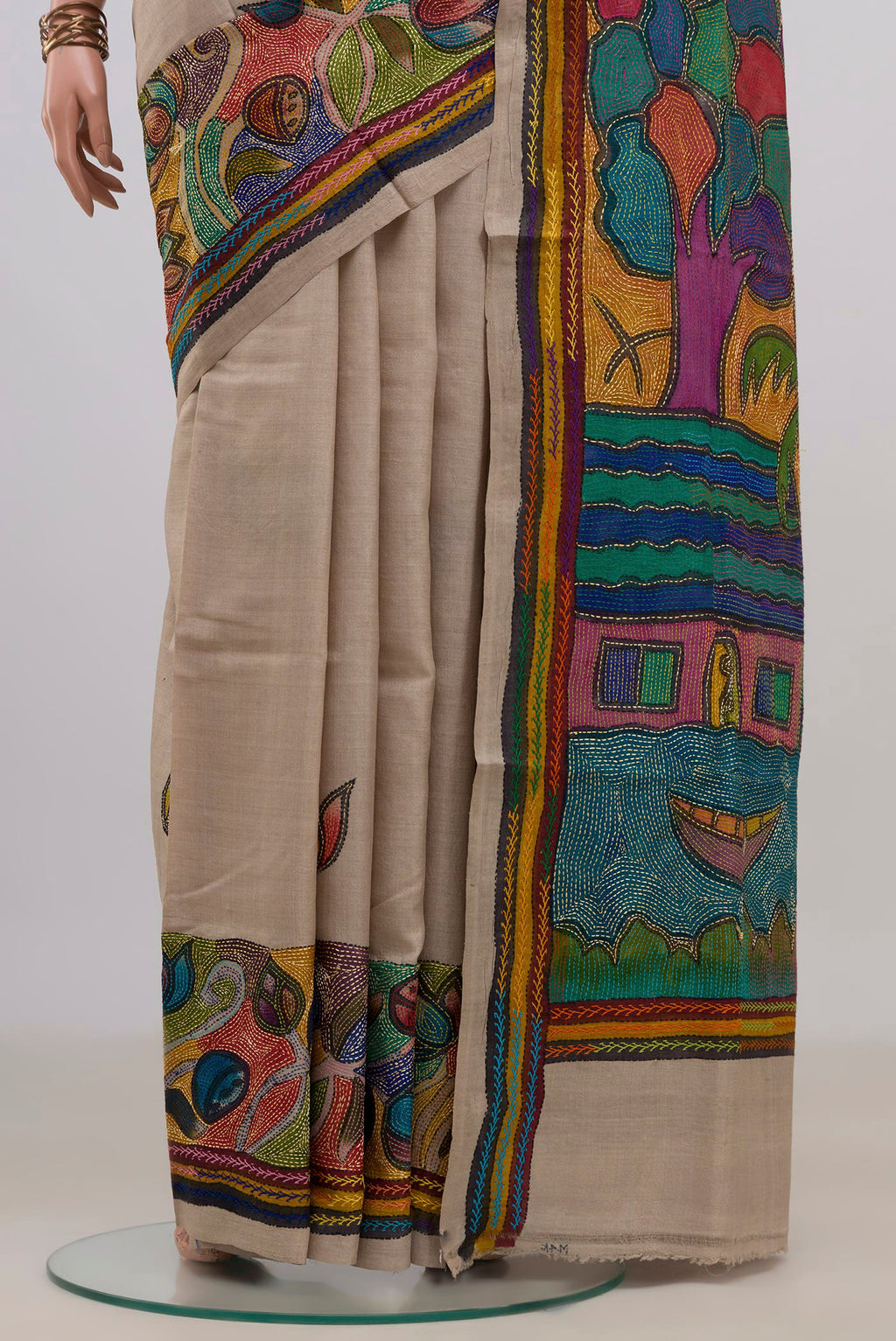 Pleats and pallu of Pure Silk Cream Tussar Saree with Kantha Work on the body and Thread Border. 