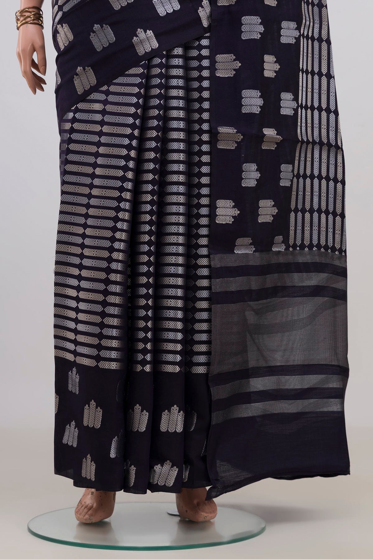 Pleats and pallu of Pure Silk Navy Blue Banarasi Raw Saree with Zari Brocade on the body and Fancy Border. 