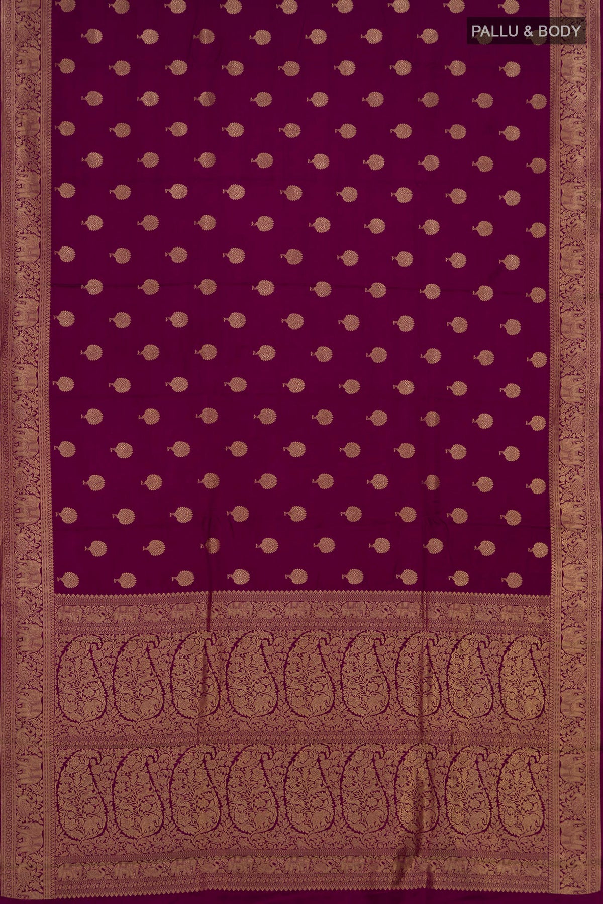 Flat view of Magenta Banarasi Saree with Zari Butta on the body and Fancy Border. 