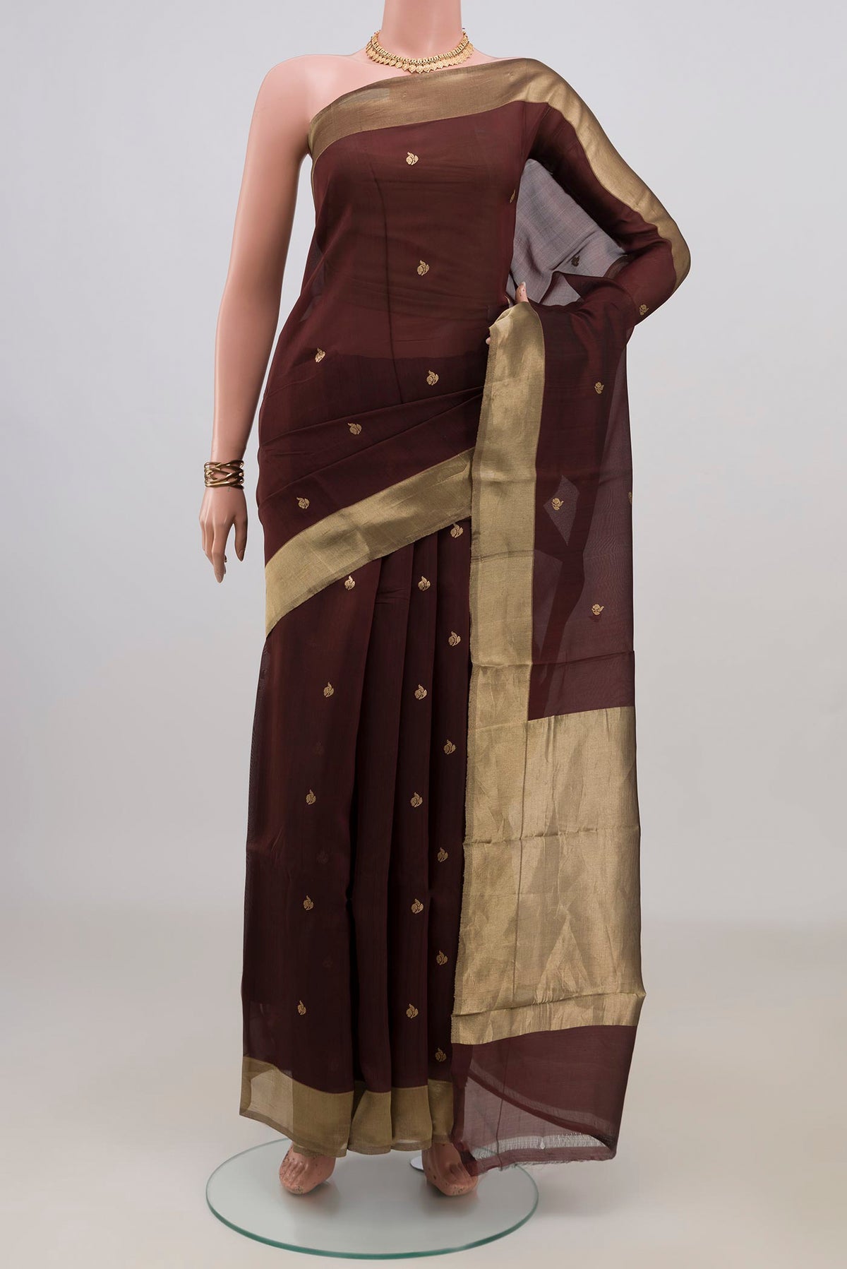 Pure Silk Brown Banarasi Kora Saree with Zari Butta on the body and Zari Border.  displayed on a mannequin
