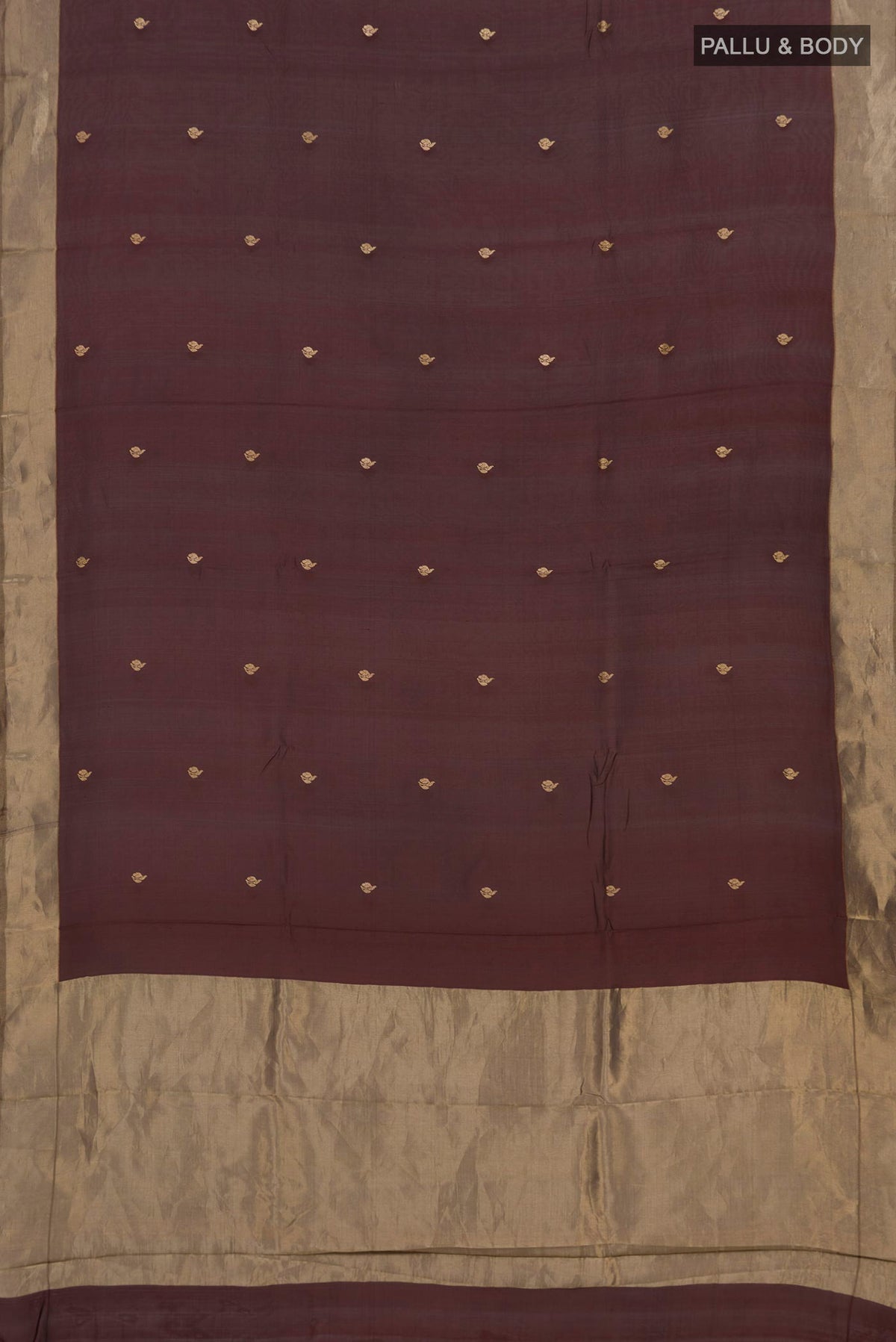 Flat view of Pure Silk Brown Banarasi Kora Saree with Zari Butta on the body and Zari Border. 