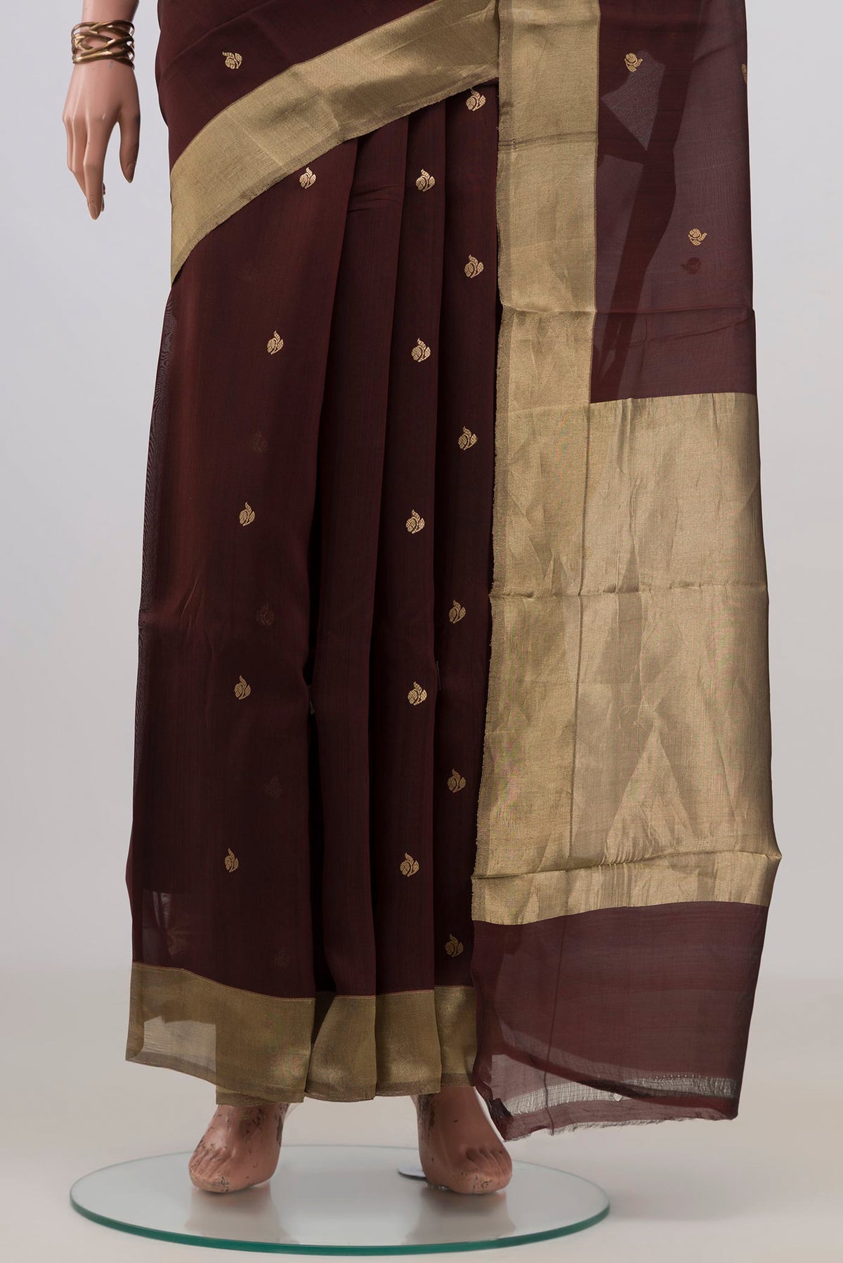 Pleats and pallu of Pure Silk Brown Banarasi Kora Saree with Zari Butta on the body and Zari Border. 