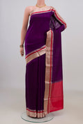 Pure Silk Purple Raw Saree with Plain Body and Zari Border.  displayed on a mannequin