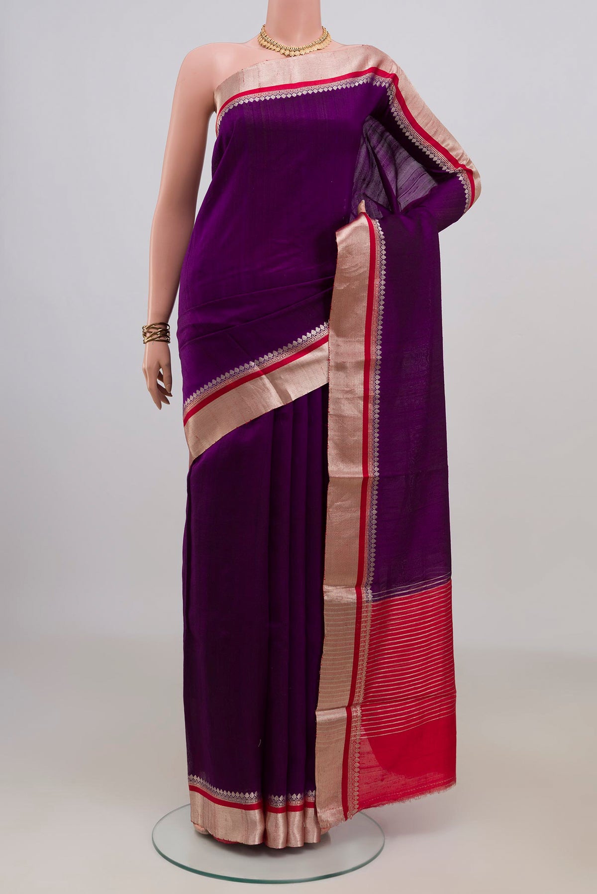 Pure Silk Purple Raw Saree with Plain Body and Zari Border.  displayed on a mannequin