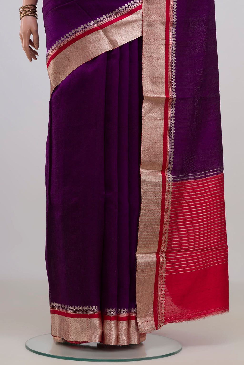 Pleats and pallu of Pure Silk Purple Raw Saree with Plain Body and Zari Border. 