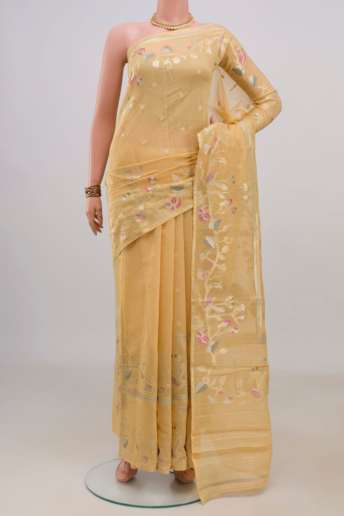Pure Silk Yellow Tussar Saree with Zari Butta on the body and Fancy Border.  displayed on a mannequin