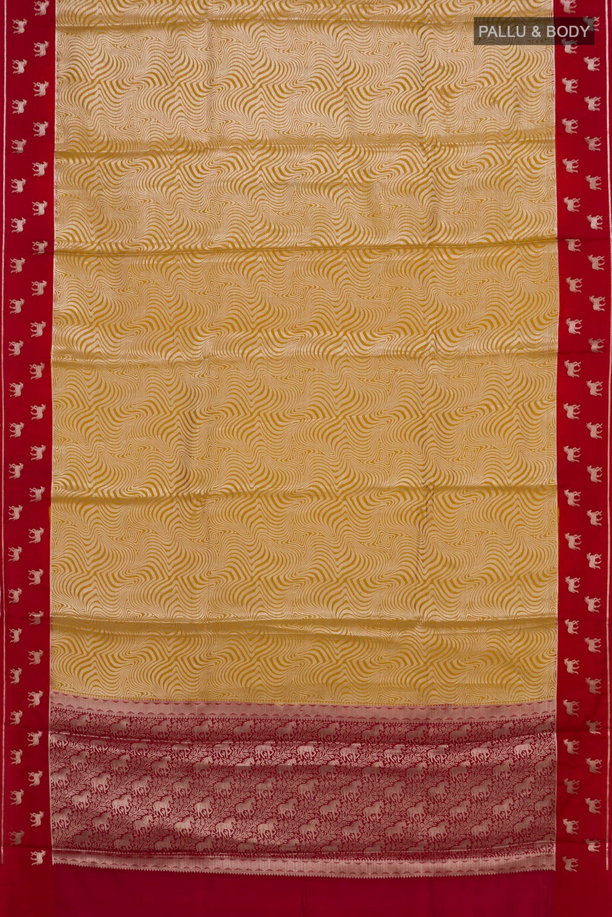 Flat view of Pure Silk Yellow Banarasi Raw Saree with Zari Brocade on the body and Fancy Border. 
