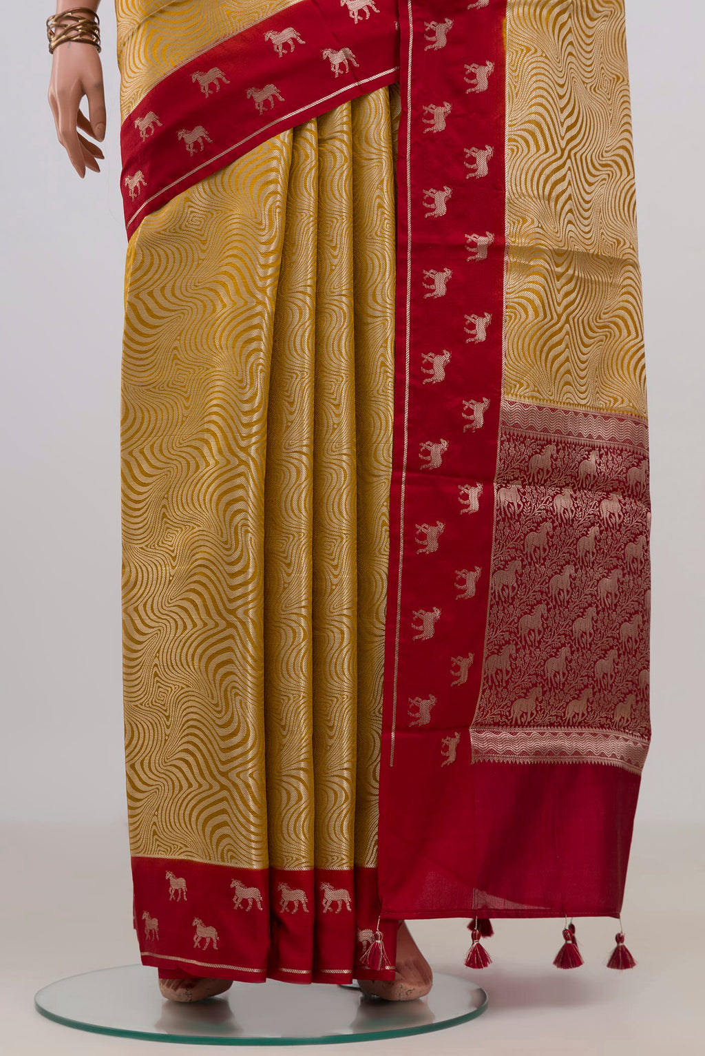 Pleats and pallu of Pure Silk Yellow Banarasi Raw Saree with Zari Brocade on the body and Fancy Border. 
