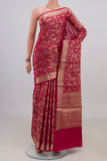 Pure Silk Dark Pink Banarasi Raw Saree with Zari Brocade on the body and Zari Border.  displayed on a mannequin