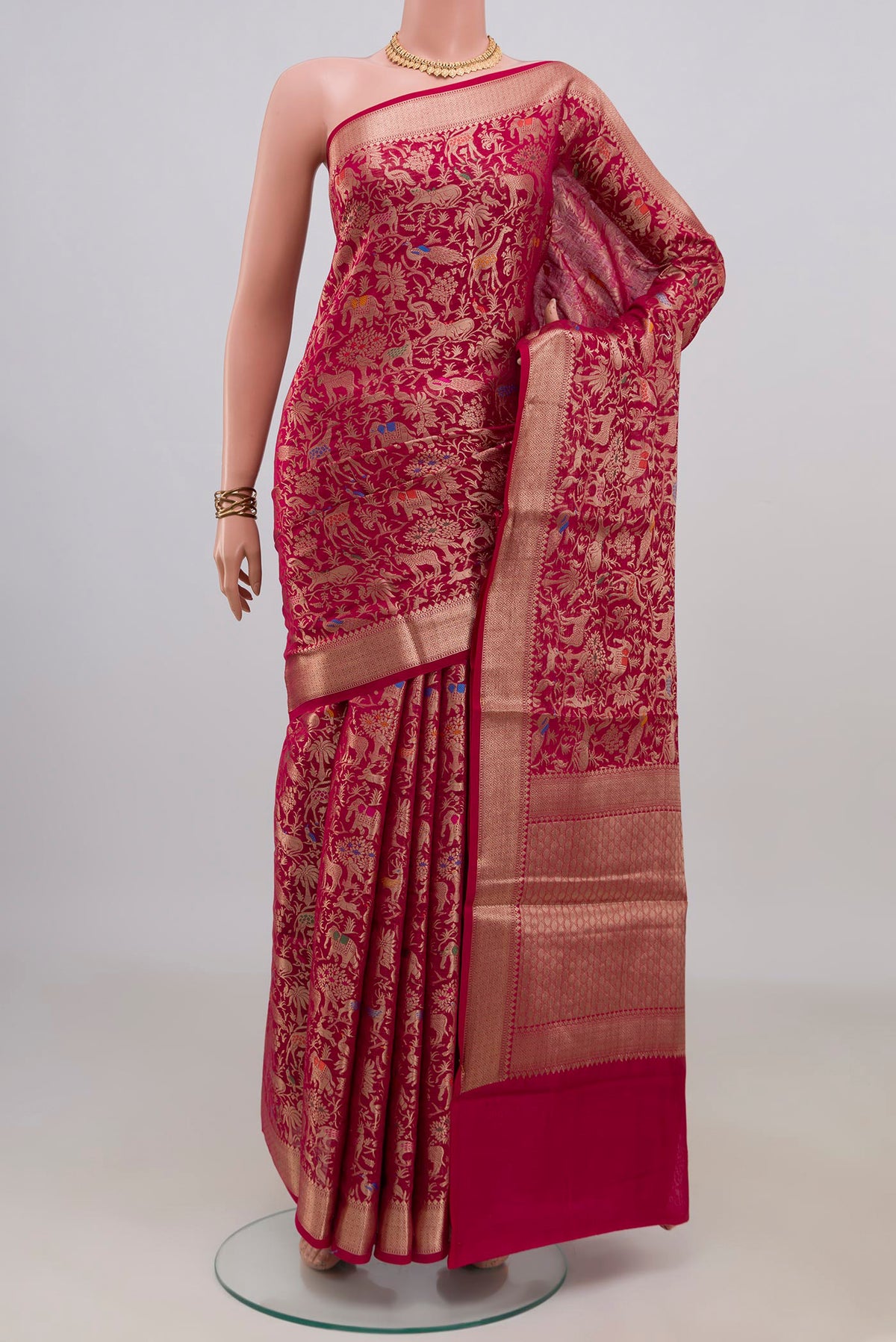 Pure Silk Dark Pink Banarasi Raw Saree with Zari Brocade on the body and Zari Border.  displayed on a mannequin