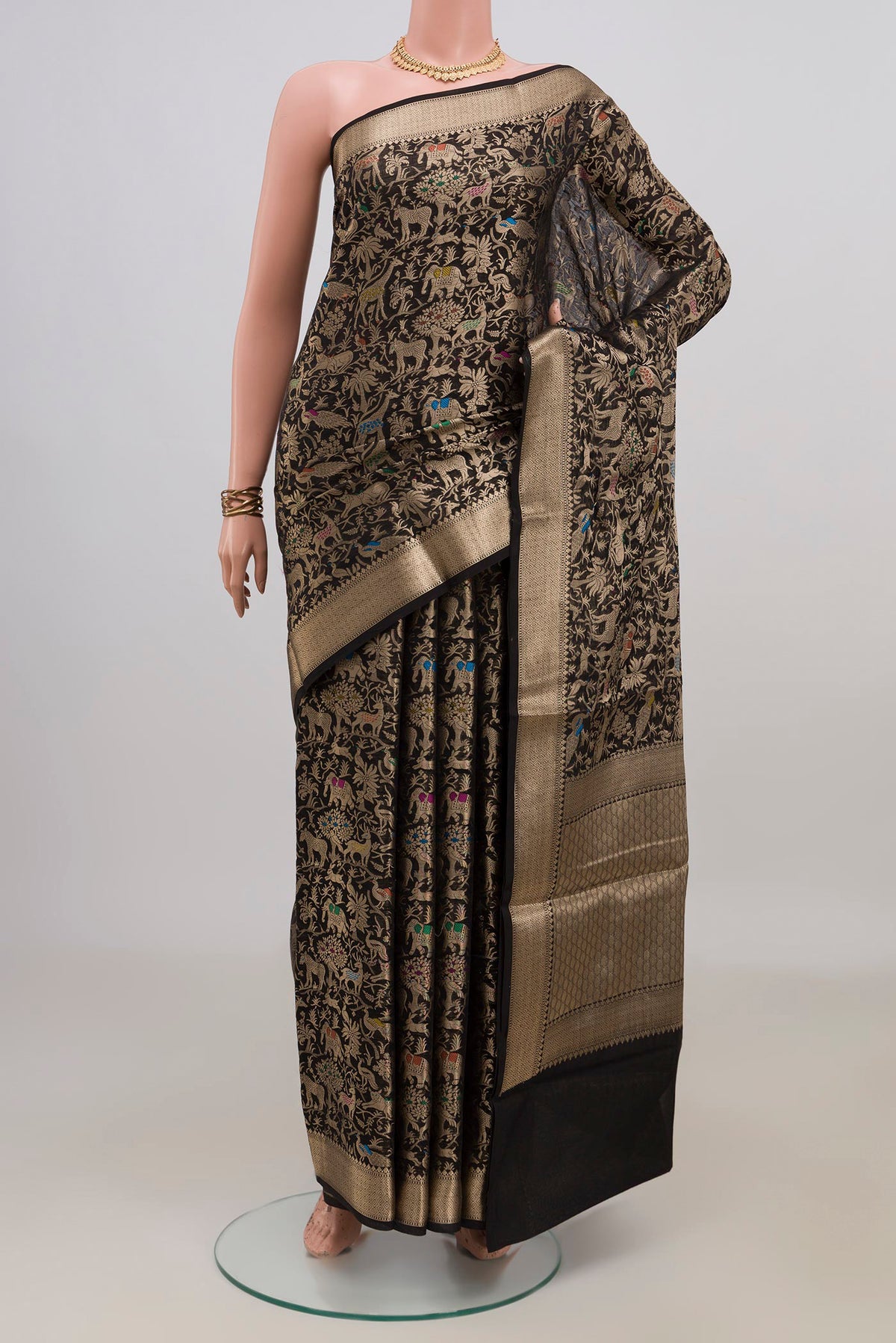 Pure Silk Black Raw Saree with Zari Brocade on the body and Zari Border.  displayed on a mannequin