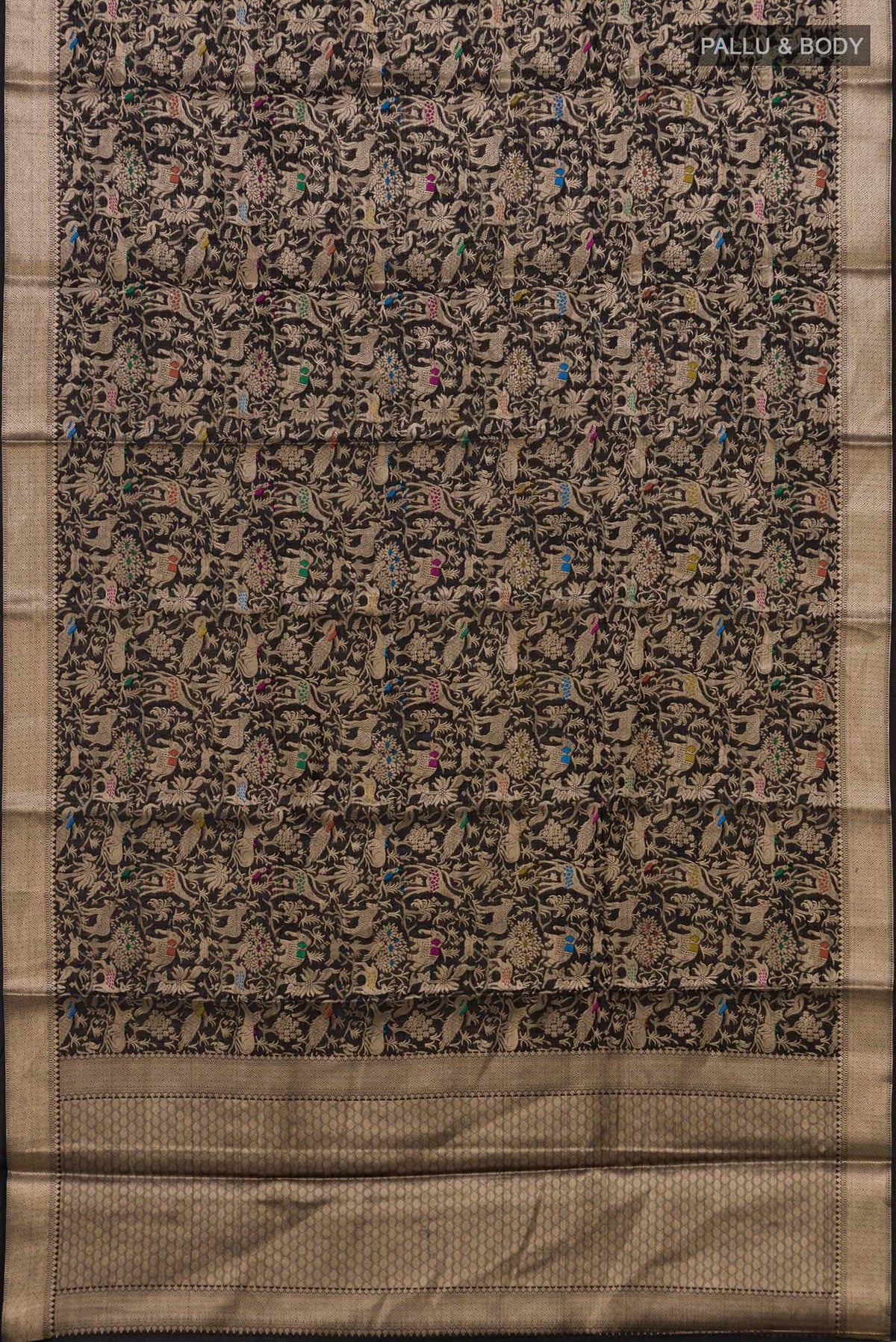Flat view of Pure Silk Black Raw Saree with Zari Brocade on the body and Zari Border. 