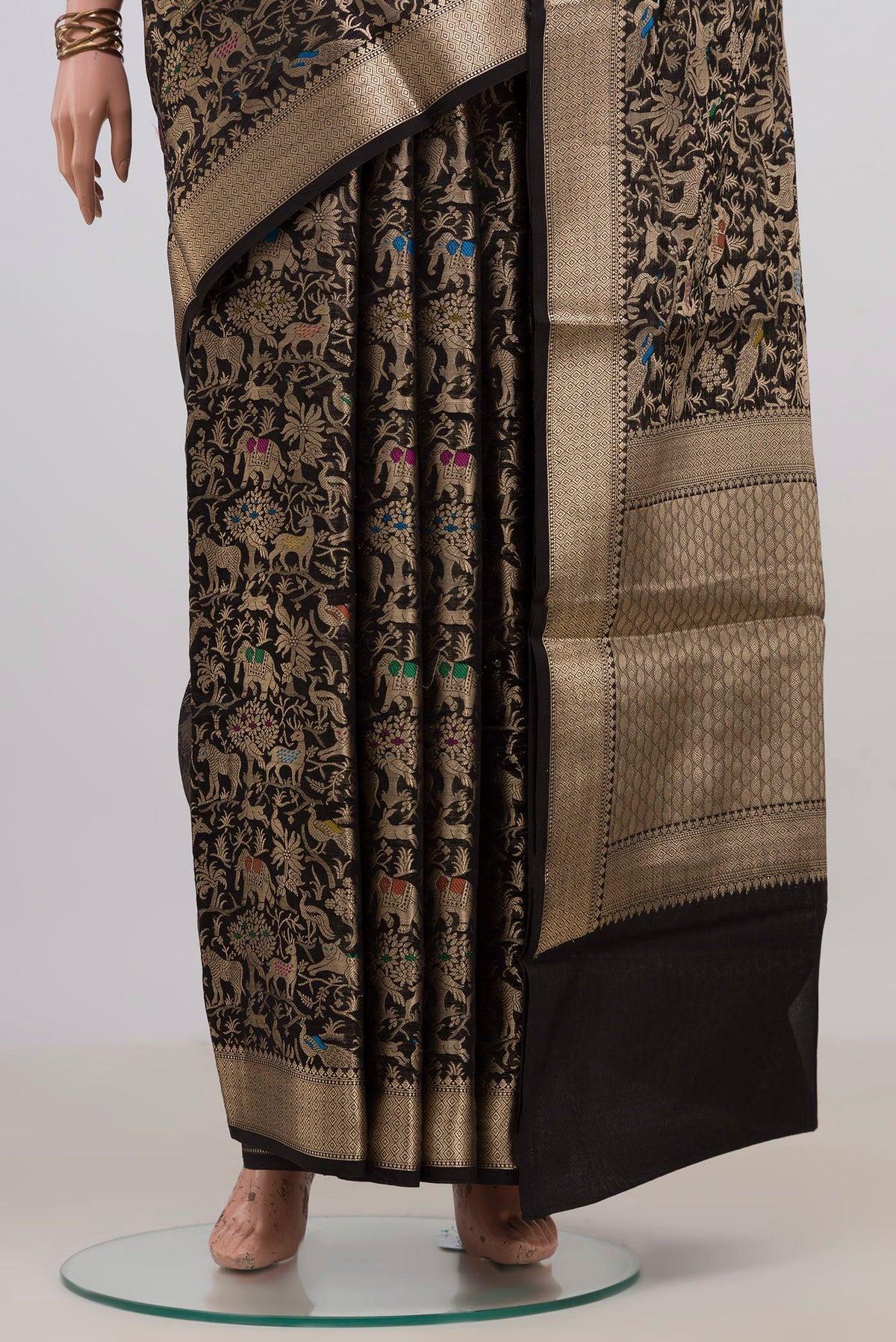 Pleats and pallu of Pure Silk Black Raw Saree with Zari Brocade on the body and Zari Border. 