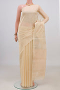 Cream Silk Cotton Saree with Zari Butta on the body and Without Border.  displayed on a mannequin