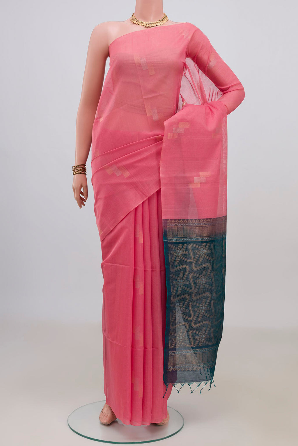 Pink Silk Cotton Saree with Zari Butta on the body and Without Border.  displayed on a mannequin