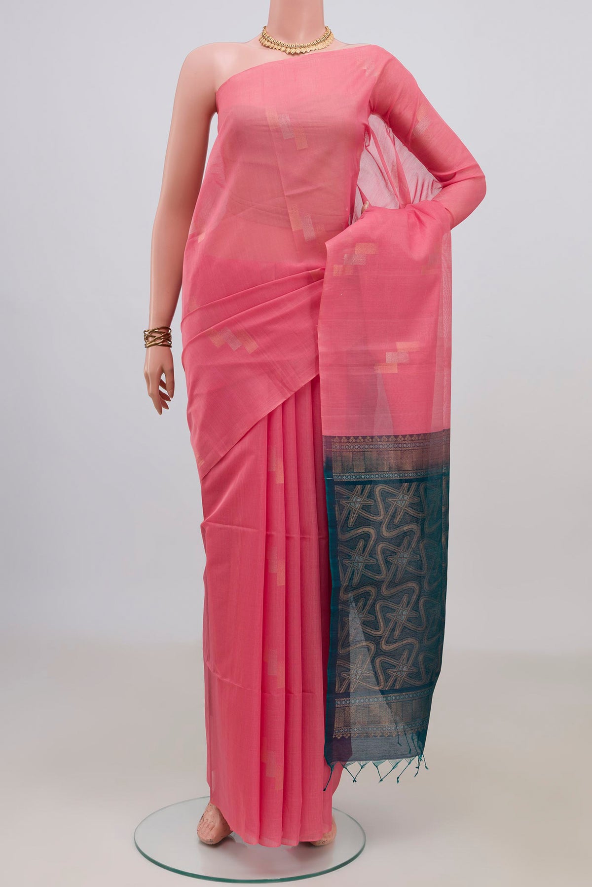 Pink Silk Cotton Saree with Zari Butta on the body and Without Border.  displayed on a mannequin