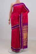 Pure Silk Pink Kanjivaram Saree with Zari Butta on the body and Zari Border.  displayed on a mannequin