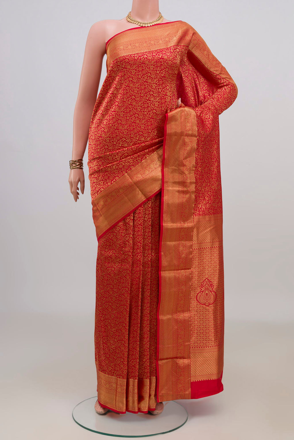 Pure Silk Red Kanjivaram Saree with Zari Brocade on the body and Zari Border.  displayed on a mannequin