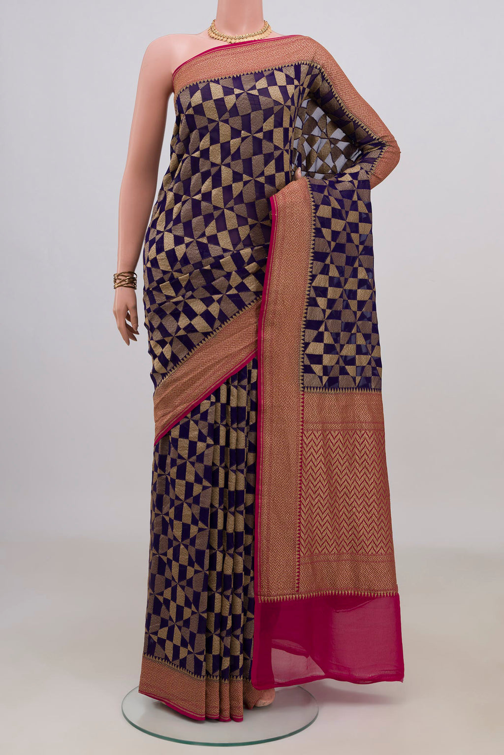 Navy Blue Banarasi Georgette Saree with Fancy on the body and Zari Border.  displayed on a mannequin