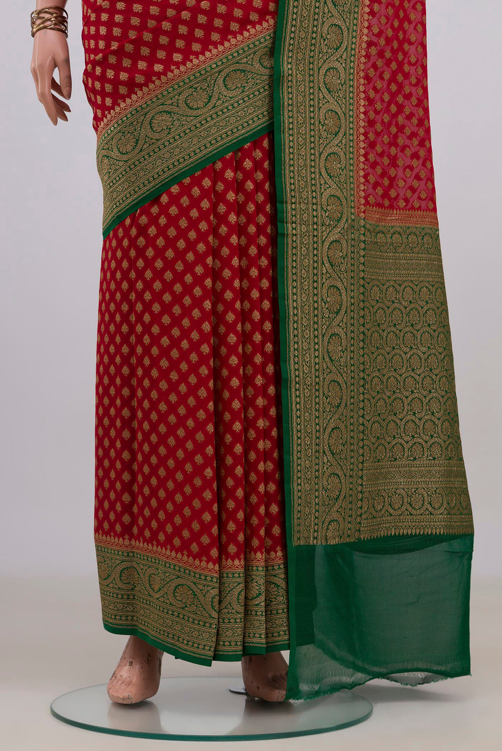 Pleats and pallu of Red Banarasi Georgette Saree with Zari Butta on the body and Fancy Border. 