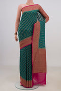 Teal Banarasi Georgette Saree with Zari Butta on the body and Fancy Border.  displayed on a mannequin
