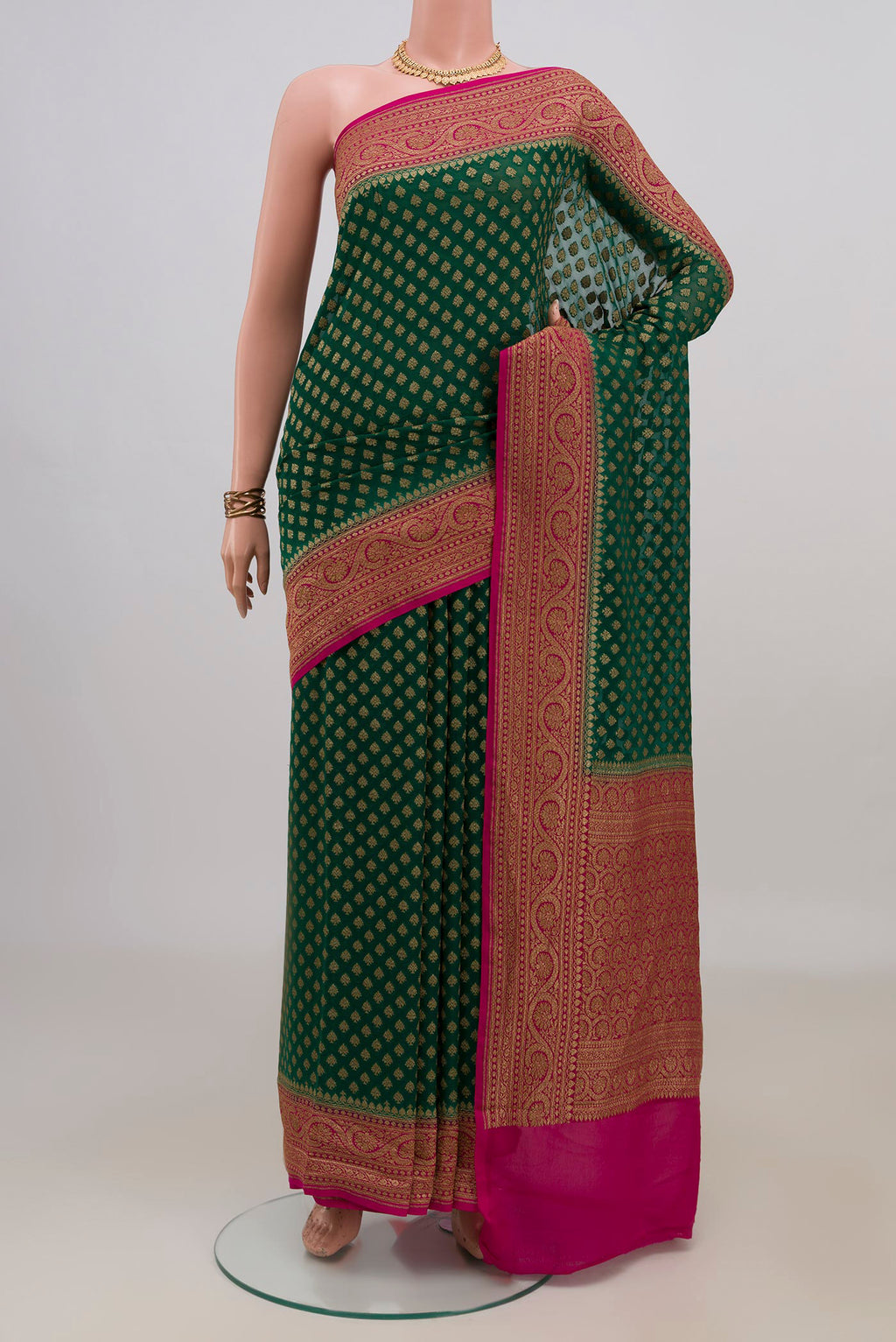 Green Banarasi Georgette Saree with Zari Butta on the body and Zari Border.  displayed on a mannequin