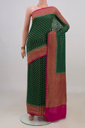 Green Banarasi Georgette Saree with Zari Butta on the body and Zari Border.  displayed on a mannequin