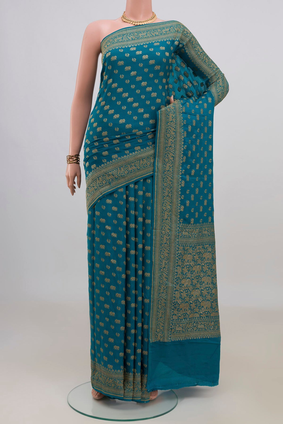 Blue Banarasi Georgette Saree with Zari Butta on the body and Zari Border.  displayed on a mannequin