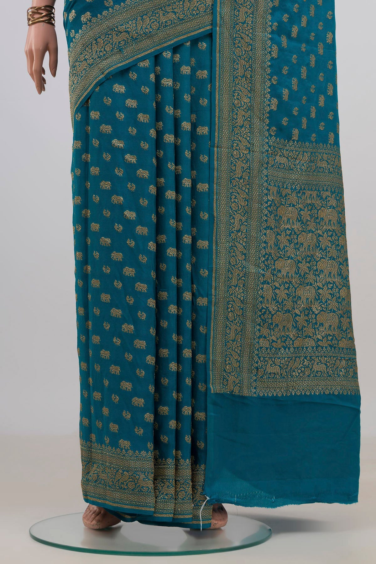 Pleats and pallu of Blue Banarasi Georgette Saree with Zari Butta on the body and Zari Border. 