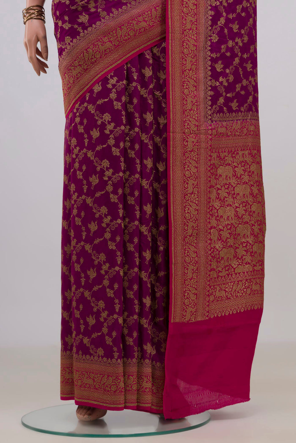Pleats and pallu of Magenta Banarasi Georgette Saree with Zari Brocade on the body and Zari Border. 
