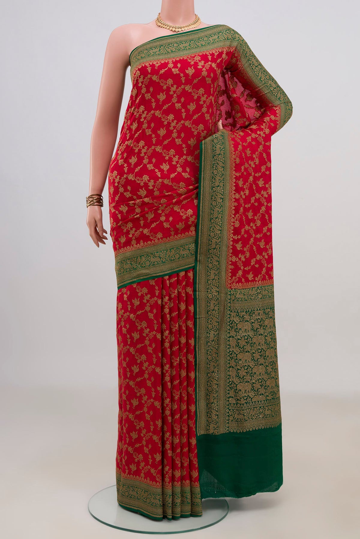 Red Banarasi Georgette Saree with Zari Brocade on the body and Zari Border.  displayed on a mannequin