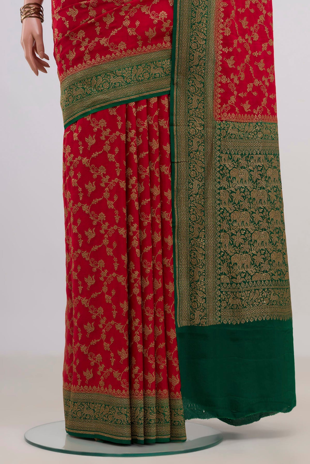 Pleats and pallu of Red Banarasi Georgette Saree with Zari Brocade on the body and Zari Border. 