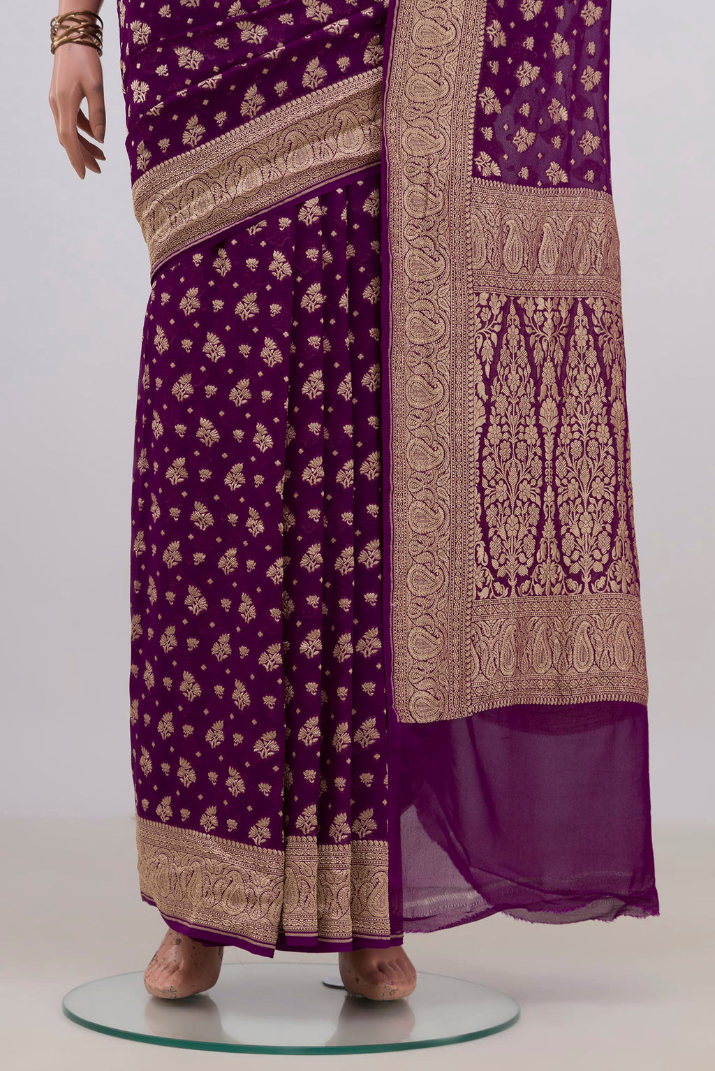 Pleats and pallu of Purple Banarasi Georgette Saree with Zari Butta on the body and Fancy Border. 