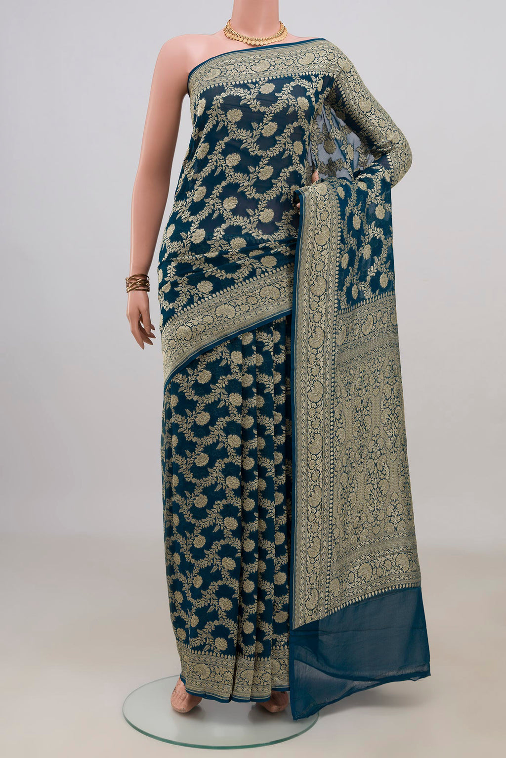 Blue Georgette Saree with Fancy on the body and Fancy Border.  displayed on a mannequin